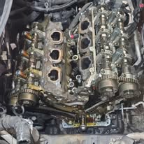 Engine with intake components removed during disassembly