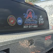 Advanced Auto Repair branding on a pickup rear window